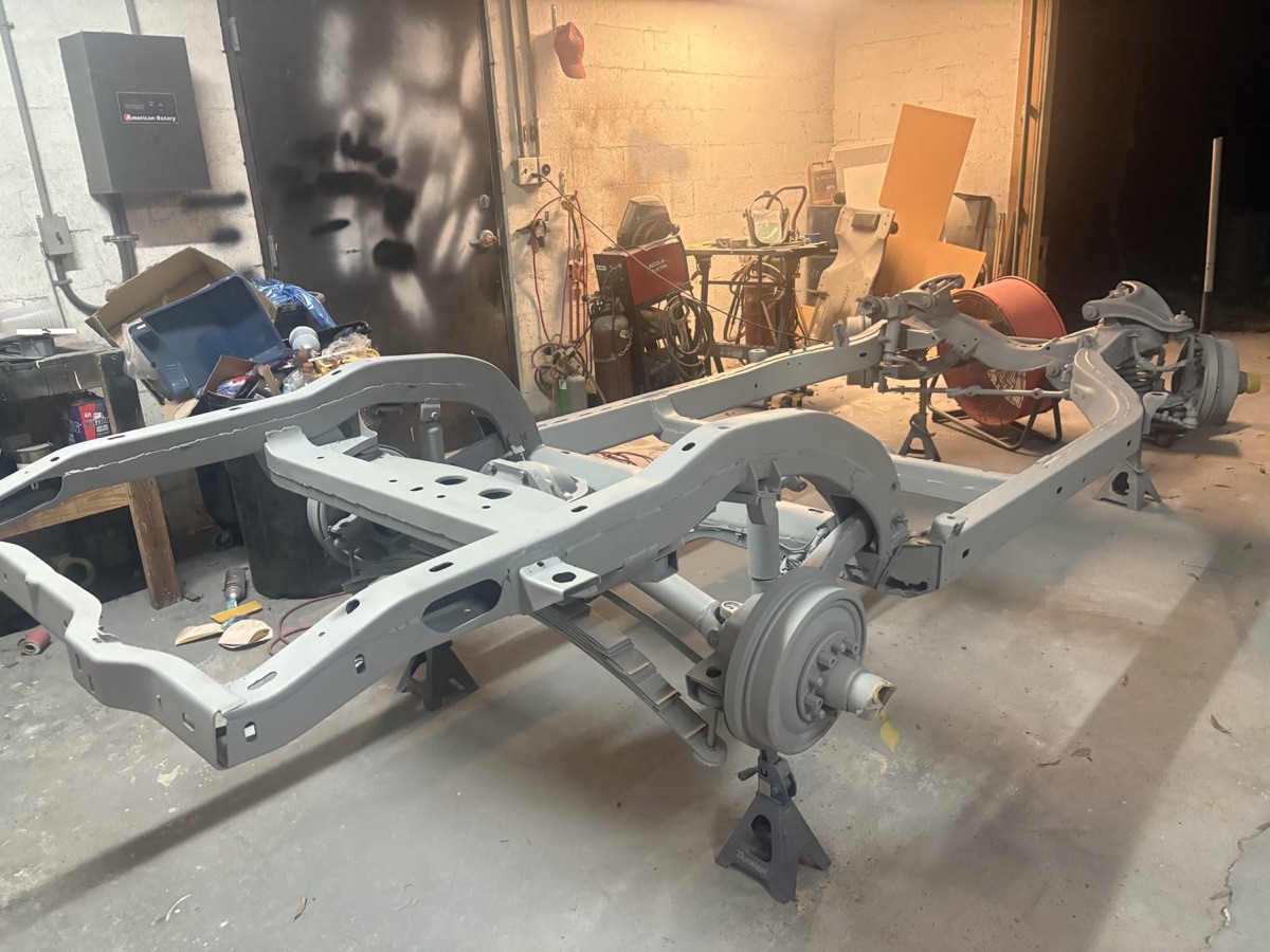 Bare-metal car frame after automotive media blasting